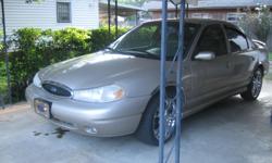 1998 Ford Contour good condition has small oil leak, a/c and cd player plays mp3&flash drive&has a remote and has panther chrome rims and recently replaced two tires and has new battery