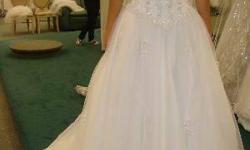 Originally bought new from David's Bridal for $900. It is in great condition, just needs light cleaning on the bottom. Asking $200 or best offer, thank you.
Description:&nbsp;2295E White Satin halter gown with tulle skirt, corset bodice, and beaded