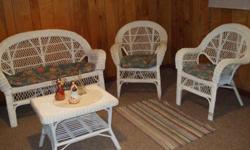 Beautiful white wicker love seat, two chairs and coffee table. All in excellent condition. Call 256-759-0478 for additional information.