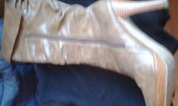 Gorgeous Stylish boots 4 inch heel Brown. Size 9 1/2 can't fit them.