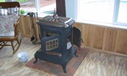 Antique cast iron wood burning stove (no cracks). Brand and age not known.