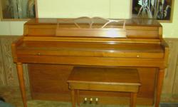 Wurlitzer spinet piano with bench for sale. It has a oak finish and is in excellent condition.&nbsp; Moving soon and I wil not have the room for it in my new place.&nbsp; If interested, please contact Bob at --