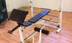 Yukon Olympic weight bench. This is a decline and incline adjustable bench. with leg curl adapter and preacher curl adapter also Olympic bar and Olympic curling bar and 305 pounds of weight with a weight tree. Do not call with any offers other then for